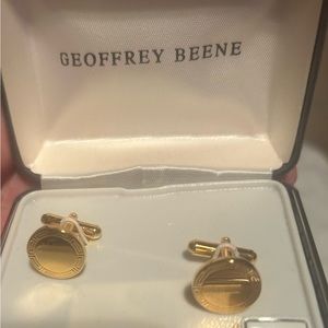 Gold cuff links by Geoffrey Beene. NWT